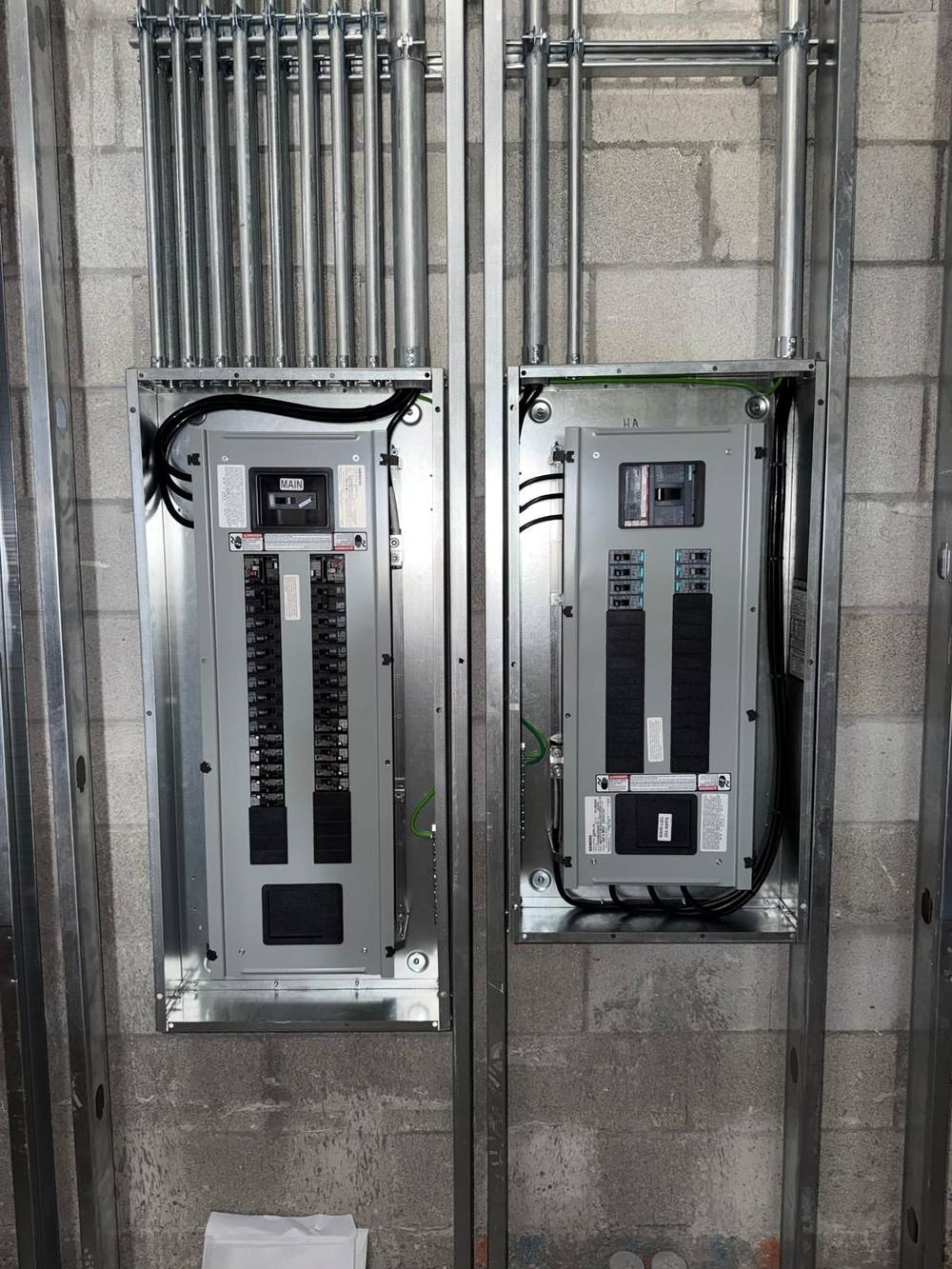 Finished panelboard installation with breakers landed and labeled