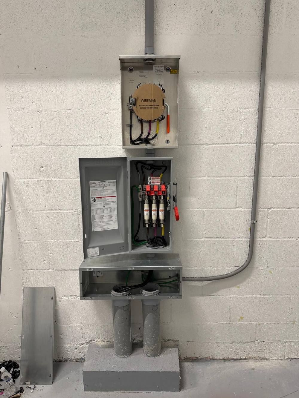 Meter can and disconnect with junction box on concrete pedestal