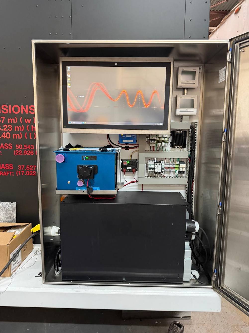 Industrial control cabinet with waveform display and relay panel